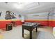 Spacious game room equipped with foosball, ping pong, and custom wall art at 4147 Oaktree Dr, Davenport, FL 33837