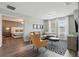 Open-concept living room with modern decor, abundant natural light, and stylish furnishings at 4147 Oaktree Dr, Davenport, FL 33837