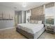 Serene main bedroom featuring a king bed, designer wallpaper, ample natural light, and access to an ensuite bathroom at 4147 Oaktree Dr, Davenport, FL 33837