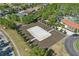 Aerial shot of a sand volleyball court in a Primary-planned community with lush landscaping at 4147 Oaktree Dr, Davenport, FL 33837