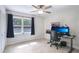 Bedroom with a window, fan and work space illuminated with natural light at 42116 E Lakeview Dr, Altoona, FL 32702