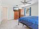 Bedroom with window, fan, and classic wood furniture at 42116 E Lakeview Dr, Altoona, FL 32702