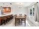 Charming dining area with a wooden table, chairs, and a window providing natural light at 42116 E Lakeview Dr, Altoona, FL 32702