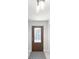 Home entryway with a glass paneled door and tiled floor at 42116 E Lakeview Dr, Altoona, FL 32702