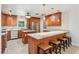 Well-equipped kitchen with granite countertops, a breakfast bar, and stainless steel appliances at 42116 E Lakeview Dr, Altoona, FL 32702