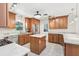 Well-equipped kitchen featuring granite countertops, a center island, and stainless steel appliances at 42116 E Lakeview Dr, Altoona, FL 32702
