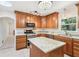 Modern kitchen with granite countertops, stainless steel appliances, and custom wood cabinetry at 42116 E Lakeview Dr, Altoona, FL 32702
