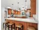 Well-equipped kitchen featuring granite countertops, a breakfast bar, and stainless steel appliances at 42116 E Lakeview Dr, Altoona, FL 32702