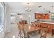 Inviting open concept layout of the dining area, kitchen, and living room with lots of light at 42116 E Lakeview Dr, Altoona, FL 32702