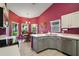 Features updated cabinets, stainless appliances, a dining area with outdoor views, and tiled floors at 4349 River Ridge Dr, Leesburg, FL 34748