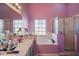 Features a soaking tub, a vanity, a large window, and a standing shower with tiled floors at 4349 River Ridge Dr, Leesburg, FL 34748