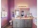Primary bath features a double vanity, bath tub, and standing shower with seamless tile at 4349 River Ridge Dr, Leesburg, FL 34748
