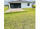 Backyard features a spacious patio and covered lanai, perfect for outdoor enjoyment at 496 Brunswick Dr, Davenport, FL 33837