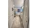 Bright bathroom features dual entry, dual vanity sinks, a tub, and a walk-in shower at 496 Brunswick Dr, Davenport, FL 33837