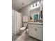 Well-lit bathroom showcasing a vanity, shower, and toilet for a functional space at 496 Brunswick Dr, Davenport, FL 33837