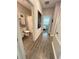 Bathroom features wood-look flooring, white fixtures, and a shower with a white curtain at 496 Brunswick Dr, Davenport, FL 33837