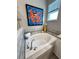 A relaxing bathtub with tile surround and bright, natural light at 496 Brunswick Dr, Davenport, FL 33837