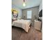 Bedroom featuring modern decor, plush carpet, and comfortable queen bed at 496 Brunswick Dr, Davenport, FL 33837