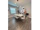 Dining area featuring a sleek table, chairs, and elegant decor for entertaining at 496 Brunswick Dr, Davenport, FL 33837