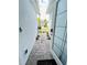 Inviting entryway featuring a stone path, tasteful landscaping, and a welcoming front door with sidelights at 496 Brunswick Dr, Davenport, FL 33837