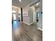 Hallway featuring wood-look tile flooring, decorative lighting, and stylish decor at 496 Brunswick Dr, Davenport, FL 33837