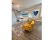 Stylish living room features modern lighting, white sofa, and vibrant art for a contemporary aesthetic at 496 Brunswick Dr, Davenport, FL 33837