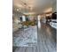 Expansive living area showcases modern decor and a seamless flow between living and dining spaces at 496 Brunswick Dr, Davenport, FL 33837
