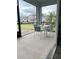 Screened patio with outdoor dining set, offering a relaxing view of the surrounding neighborhood at 496 Brunswick Dr, Davenport, FL 33837