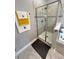 Shower features a glass enclosure with tiled walls at 496 Brunswick Dr, Davenport, FL 33837
