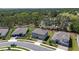 Beautiful aerial view of a suburban neighborhood with well-maintained lawns and mature trees at 524 Avila Pl, Howey In The Hills, FL 34737