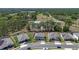 Aerial view of homes in a community surrounded by green space and roads, showcasing the neighborhood layout at 524 Avila Pl, Howey In The Hills, FL 34737