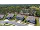 Beautiful aerial view of a suburban neighborhood with well-maintained lawns and mature trees at 524 Avila Pl, Howey In The Hills, FL 34737