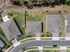 Aerial view captures neat landscaping and orderly streets, illustrating a well-planned residential community at 524 Avila Pl, Howey In The Hills, FL 34737