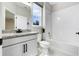 Clean bathroom with granite countertop, white cabinets, and a shower-tub combination at 524 Avila Pl, Howey In The Hills, FL 34737
