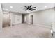 Spacious bonus room featuring plush carpet, neutral walls, double doors, and ceiling fan at 524 Avila Pl, Howey In The Hills, FL 34737