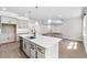 Spacious kitchen with a large island, modern fixtures, and open layout to the living area at 524 Avila Pl, Howey In The Hills, FL 34737