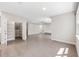 Bright living room featuring neutral paint, wood-look tile flooring, and ample natural light at 524 Avila Pl, Howey In The Hills, FL 34737