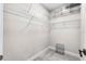 Walk-in closet with white wire shelving for efficient storage organization at 524 Avila Pl, Howey In The Hills, FL 34737