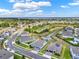 Aerial view of the community, highlighting water features and nearby lakes at 533 Avila Pl, Howey In The Hills, FL 34737