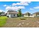 Spacious backyard with green grass and developing landscaping at 533 Avila Pl, Howey In The Hills, FL 34737