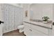 Stylish bathroom featuring a vanity sink and a shower curtain at 533 Avila Pl, Howey In The Hills, FL 34737