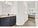 Bright bathroom with granite countertop and an open bedroom view at 533 Avila Pl, Howey In The Hills, FL 34737