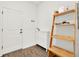 Welcoming entryway with wooden floors, shoe storage and decor at 533 Avila Pl, Howey In The Hills, FL 34737