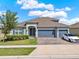 Beautiful single Gathering home with a three car garage, landscaped yard and curb appeal at 533 Avila Pl, Howey In The Hills, FL 34737