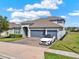 Single Gathering home with a three car garage, landscaped yard and curb appeal at 533 Avila Pl, Howey In The Hills, FL 34737