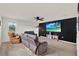 Spacious living room with tv and comfortable seating area at 533 Avila Pl, Howey In The Hills, FL 34737