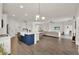 Open-concept living space with a kitchen island, dining area, and cozy living room at 533 Avila Pl, Howey In The Hills, FL 34737