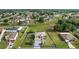 Expansive aerial view showing property lines, showing a green home with large lot at 54 Andora Ct, Kissimmee, FL 34758