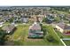 Expansive aerial view of a home with enclosed pool and large lot at 54 Andora Ct, Kissimmee, FL 34758