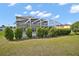 A beautiful backyard with a screened-in pool and well-maintained landscaping at 54 Andora Ct, Kissimmee, FL 34758
